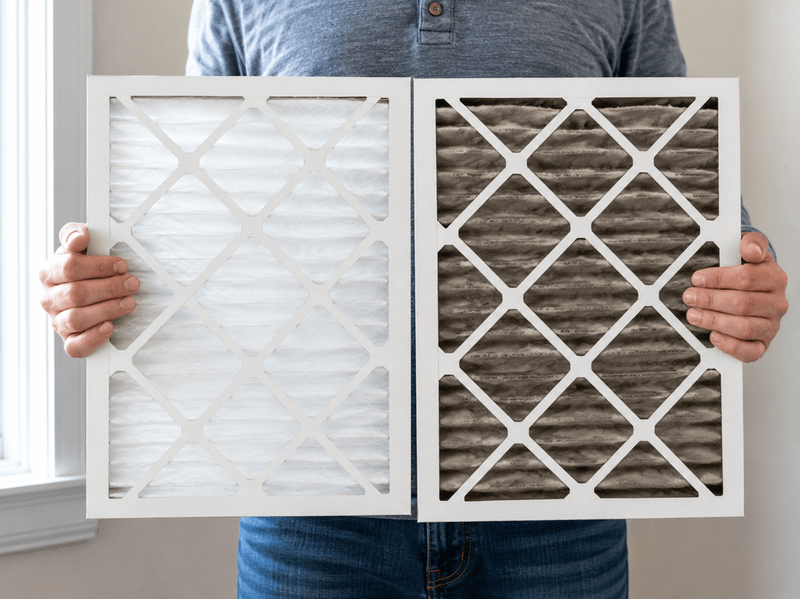 Side-by-side comparison of a clean white HVAC filter and a gray, smoke-loaded filter pulled from a Garland-area home.